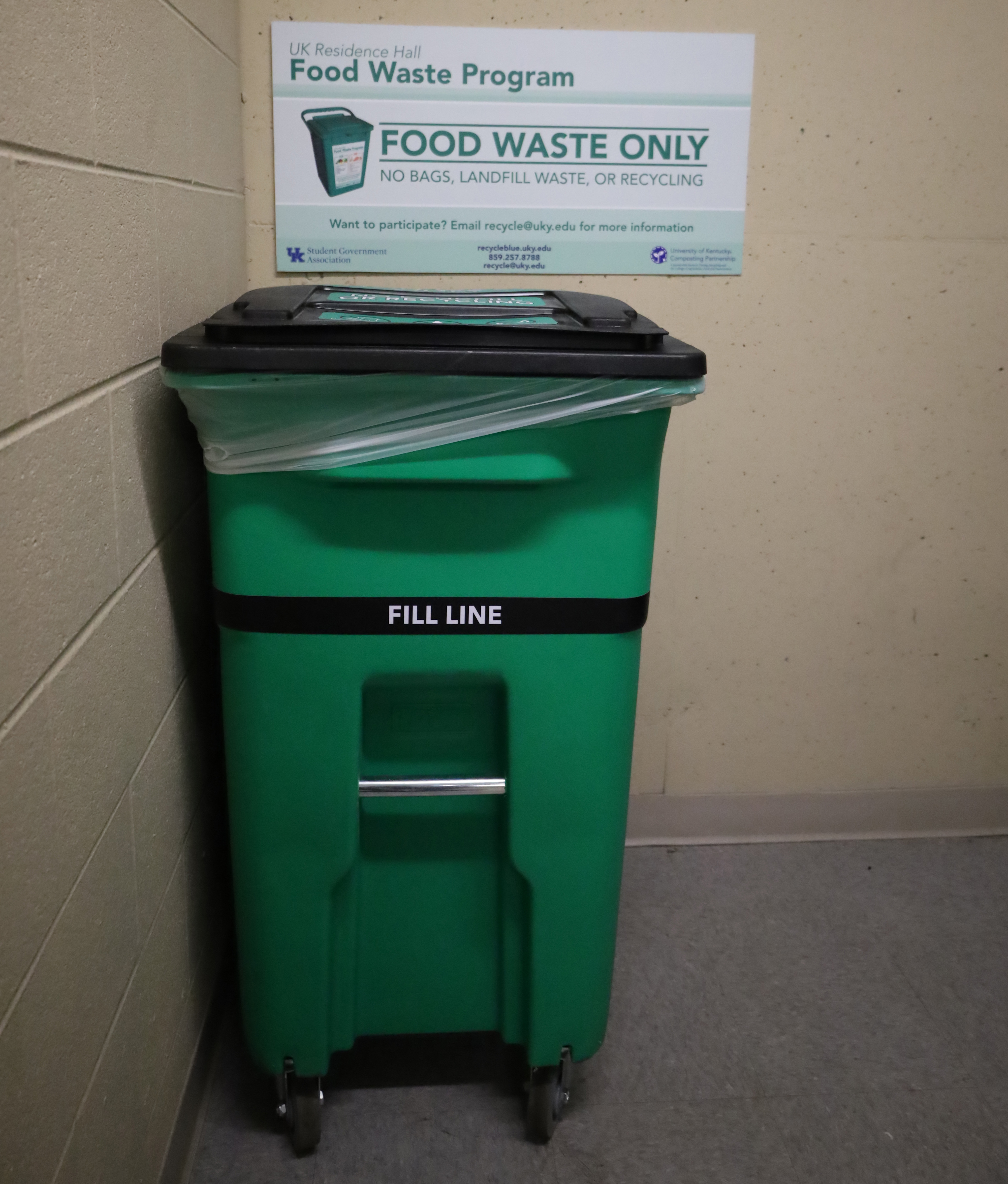 the 50-gallon food waste roll cart in University Flats compactor room.