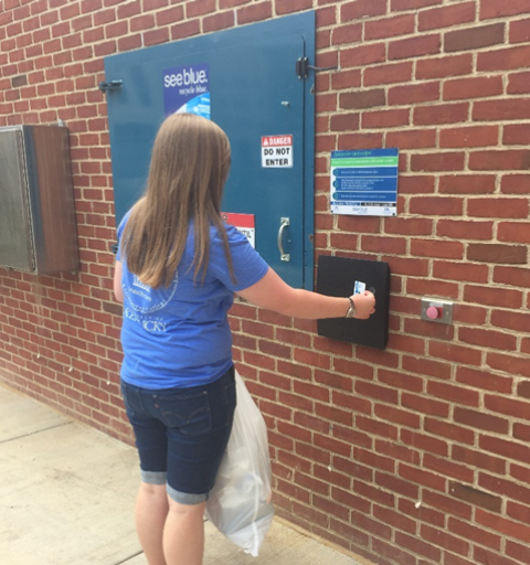 a UK student using their UKID to open the recycling outdoor compactor