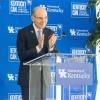 President Eli Capilouto clapping at podium during announcement ceremony